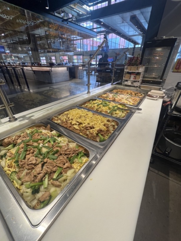 Trays of noodles and stir fries on the steam table at Union Street Market